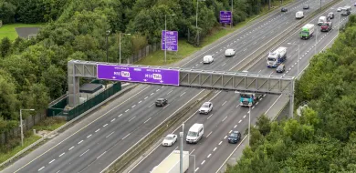 The image shows the M50 motorway in Dublin with vehicles driving over it.